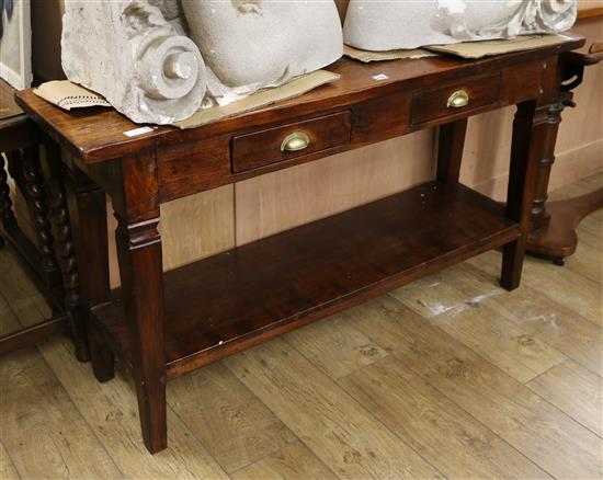 An oak dresser base, fitted two small drawers W.140cm